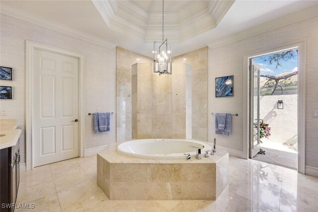 full bathroom with a tray ceiling, ornamental molding, vanity, baseboards, and a bath