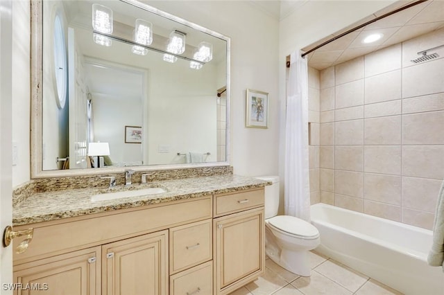 full bath with shower / tub combo, vanity, toilet, and tile patterned floors