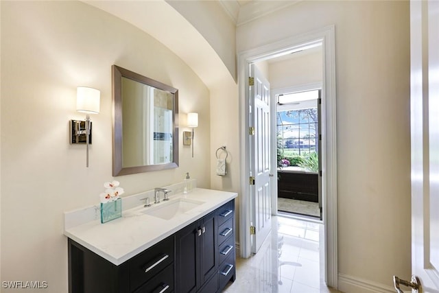 bathroom with baseboards and vanity