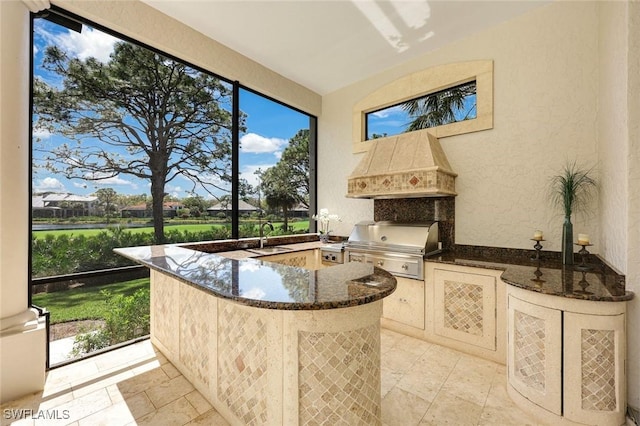 sunroom featuring a sink