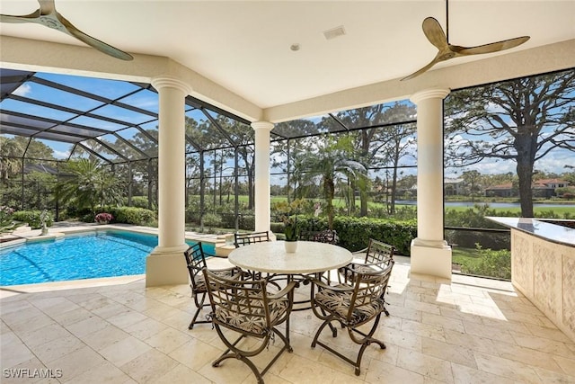 exterior space with a lanai, visible vents, and an outdoor pool