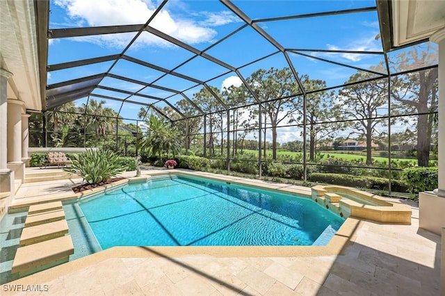 view of pool featuring glass enclosure, a patio area, and a pool with connected hot tub