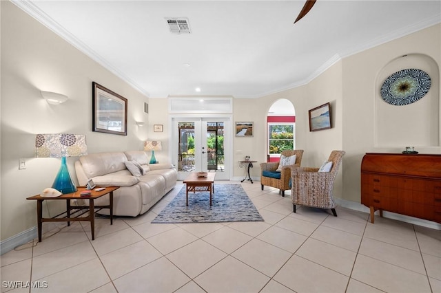 living area featuring light tile patterned floors, french doors, ornamental molding, and visible vents