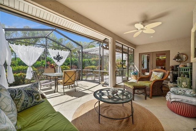 sunroom / solarium featuring a wealth of natural light and ceiling fan