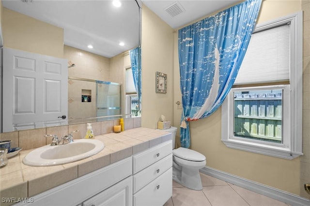 full bath featuring visible vents, toilet, a shower stall, vanity, and tile patterned floors