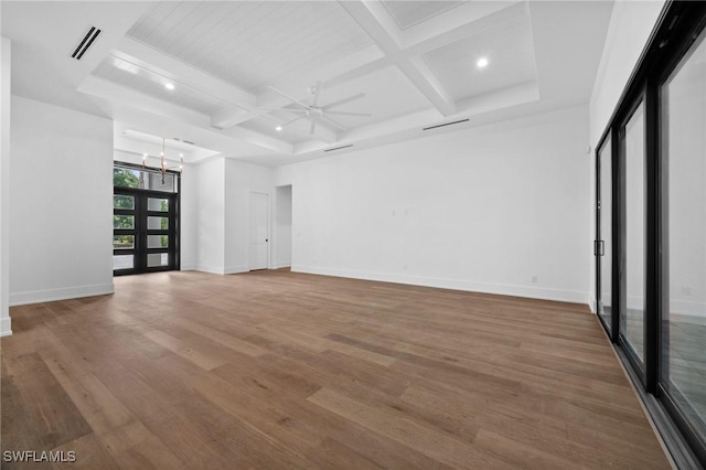 3233 64th St SW, Naples, FL 34105 - empty room with coffered ceiling, wood finished floors, beam ceiling, a ceiling fan, and a chandelier