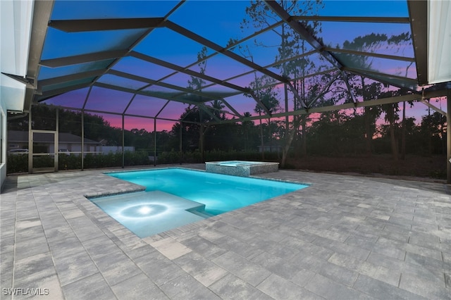 3233 64th St SW, Naples, FL 34105 - view of swimming pool with a patio, a pool with connected hot tub, and glass enclosure