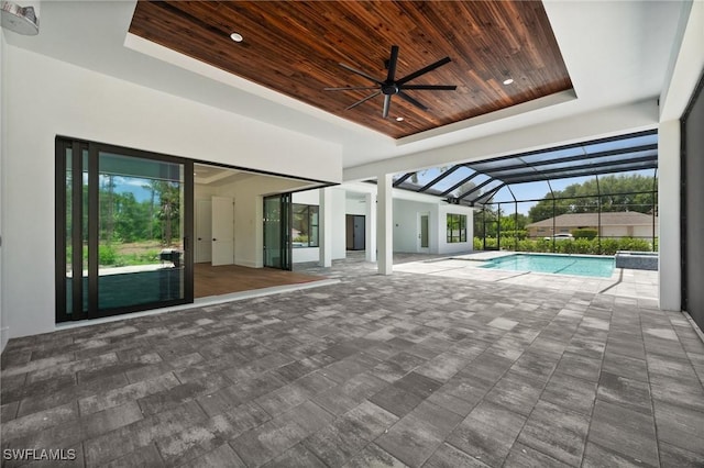3233 64th St SW, Naples, FL 34105 - swimming pool featuring a ceiling fan, a patio area, and glass enclosure