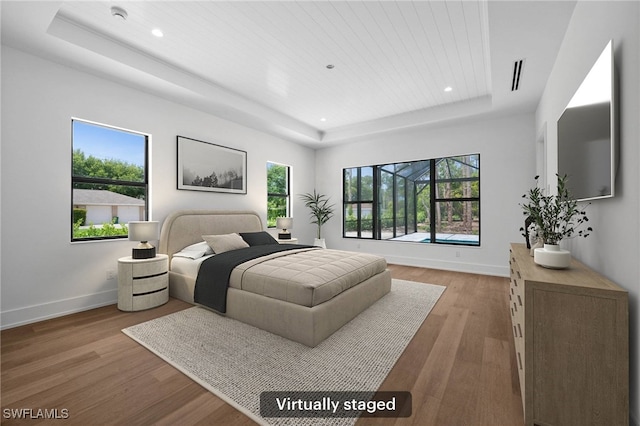 3233 64th St SW, Naples, FL 34105 - bedroom featuring a raised ceiling, wood finished floors, recessed lighting, and wooden ceiling