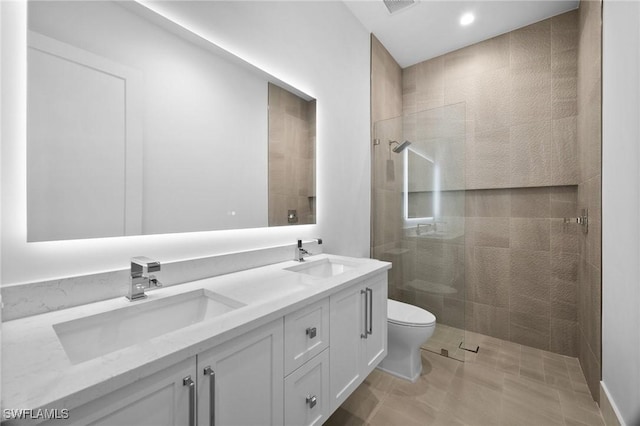 3233 64th St SW, Naples, FL 34105 - bathroom with double vanity, tiled shower, and recessed lighting