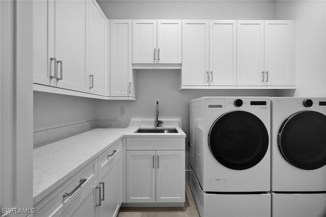 3233 64th St SW, Naples, FL 34105 - laundry area featuring independent washer and dryer and cabinet space