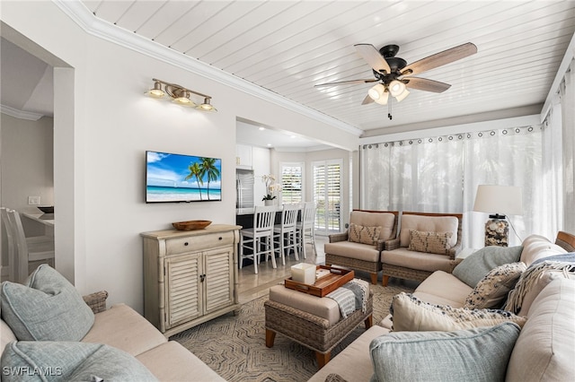 living room featuring a ceiling fan, wooden ceiling, and crown molding