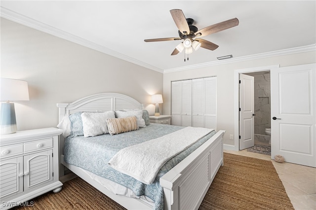 bedroom with visible vents, a closet, crown molding, light tile patterned floors, and ceiling fan