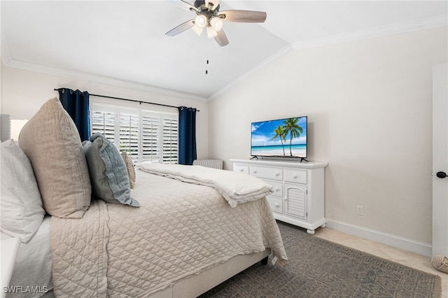 bedroom with light tile patterned floors, baseboards, lofted ceiling, and ornamental molding