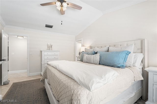 bedroom featuring visible vents, lofted ceiling, baseboards, and ornamental molding