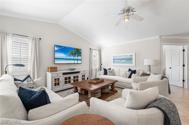 living area featuring ceiling fan, lofted ceiling, light tile patterned floors, and ornamental molding