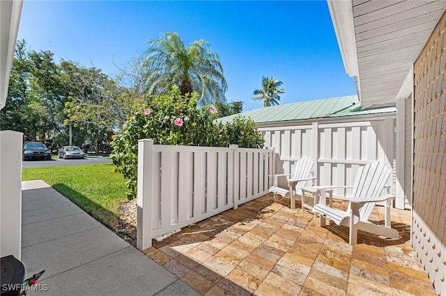 view of patio featuring fence