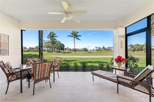 sunroom with a ceiling fan