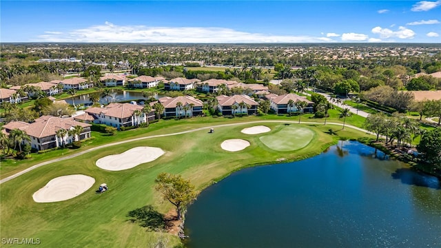 bird's eye view with golf course view, a water view, and a residential view