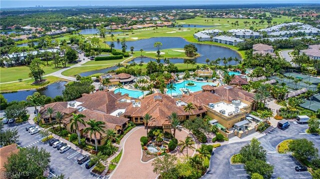 bird's eye view featuring a water view and golf course view