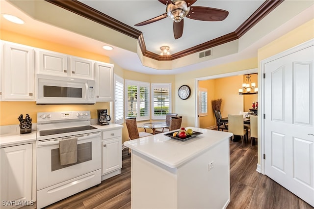 kitchen featuring white appliances, visible vents, white cabinets, dark wood finished floors, and crown molding