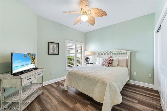 bedroom with wood finished floors, a ceiling fan, and baseboards