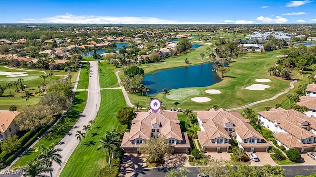 birds eye view of property featuring golf course view, a water view, and a residential view