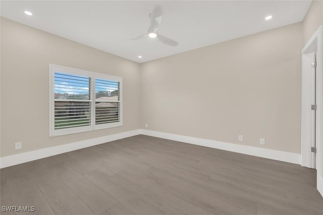 unfurnished room featuring recessed lighting, baseboards, dark wood finished floors, and a ceiling fan