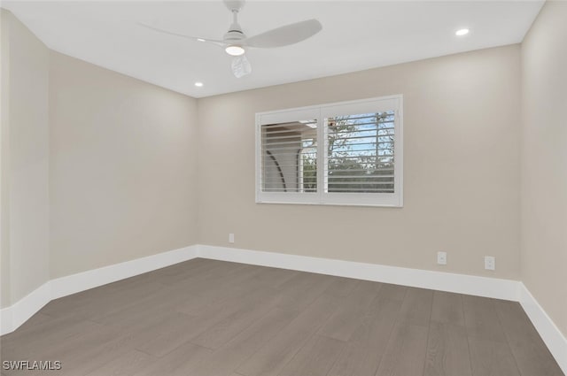 unfurnished room featuring ceiling fan, baseboards, wood finished floors, and recessed lighting