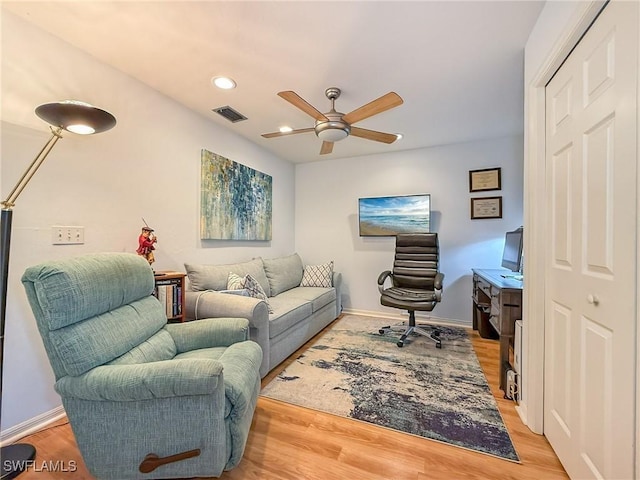 office space with recessed lighting, visible vents, ceiling fan, light wood-type flooring, and baseboards