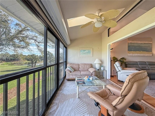 sunroom / solarium with lofted ceiling and ceiling fan