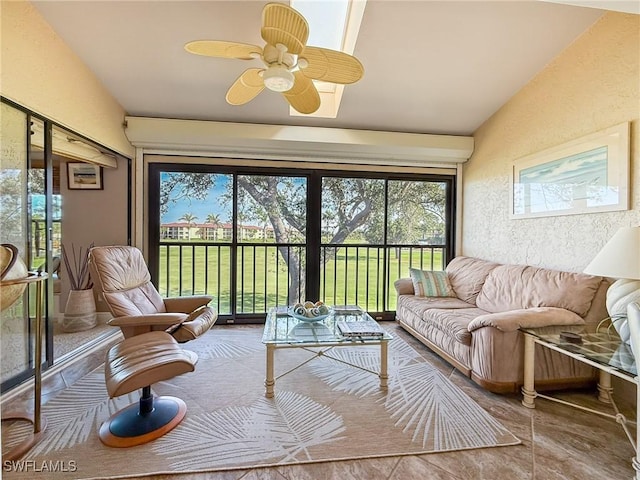 sunroom / solarium featuring lofted ceiling and ceiling fan