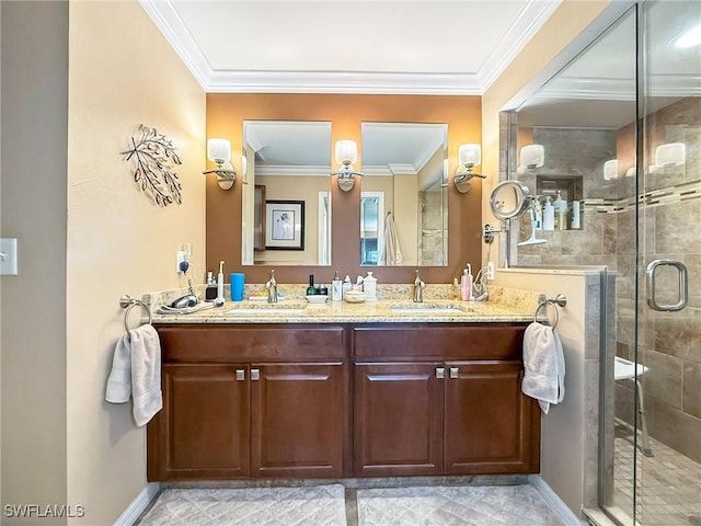 bathroom featuring double vanity, crown molding, a sink, and a shower stall