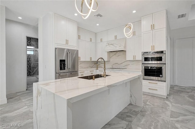 kitchen featuring a sink, stainless steel appliances, marble finish floor, and visible vents