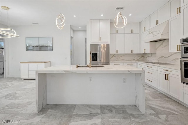 kitchen with visible vents, a kitchen island with sink, under cabinet range hood, appliances with stainless steel finishes, and tasteful backsplash