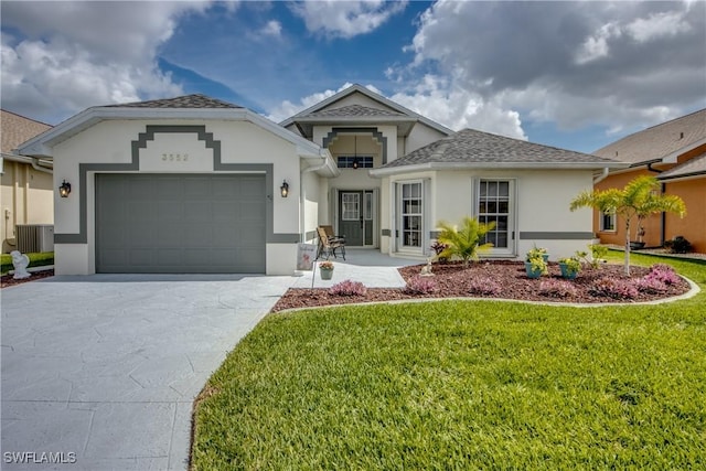 ranch-style home featuring an attached garage, central AC, driveway, stucco siding, and a front lawn