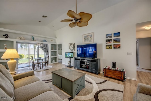 living room featuring light wood finished floors, visible vents, a ceiling fan, high vaulted ceiling, and baseboards