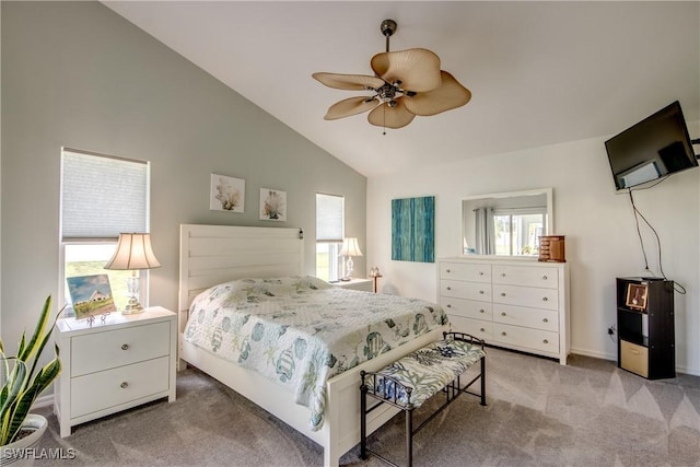 bedroom featuring lofted ceiling, ceiling fan, and light colored carpet