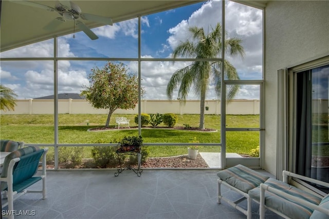 sunroom featuring ceiling fan