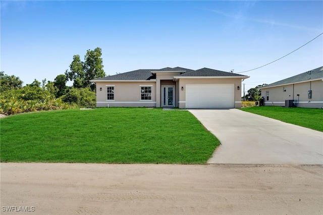 3109 11th St W, Lehigh Acres, FL 33971 - prairie-style house featuring a front yard, cooling unit, stucco siding, concrete driveway, and an attached garage