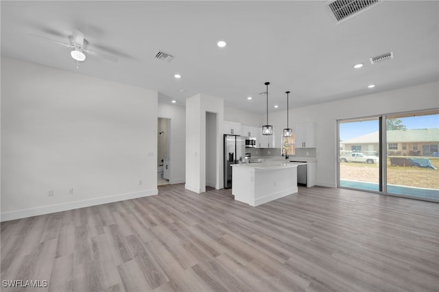 3109 11th St W, Lehigh Acres, FL 33971 - unfurnished living room with recessed lighting, visible vents, and light wood-style flooring