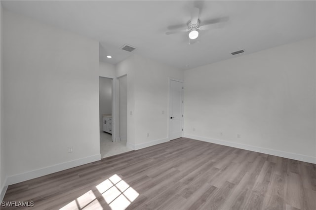 3109 11th St W, Lehigh Acres, FL 33971 - unfurnished room with a ceiling fan, wood finished floors, and visible vents