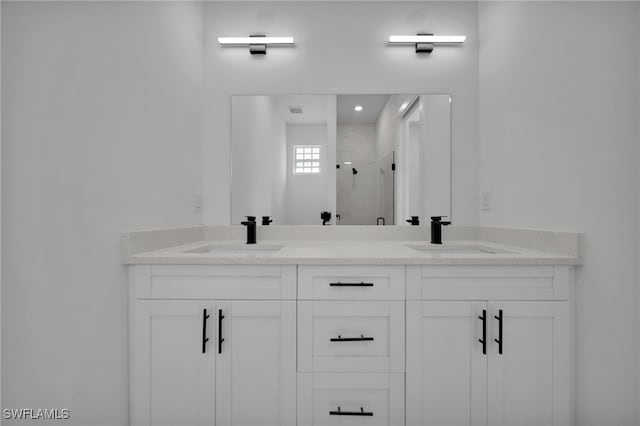 3109 11th St W, Lehigh Acres, FL 33971 - bathroom with double vanity, visible vents, a shower stall, and a sink
