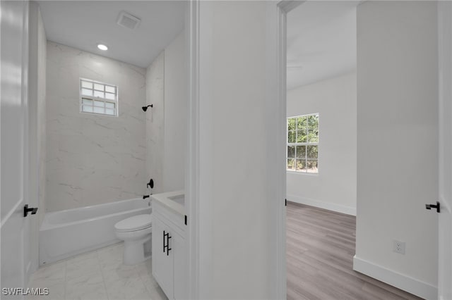 3109 11th St W, Lehigh Acres, FL 33971 - bathroom featuring baseboards, shower / bathing tub combination, toilet, and visible vents