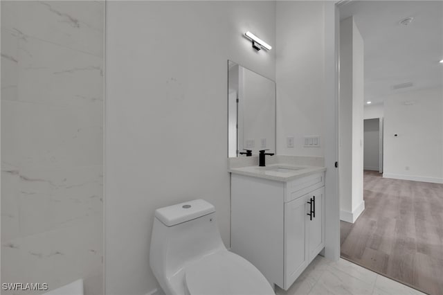 3109 11th St W, Lehigh Acres, FL 33971 - bathroom with toilet, marble finish floor, and vanity