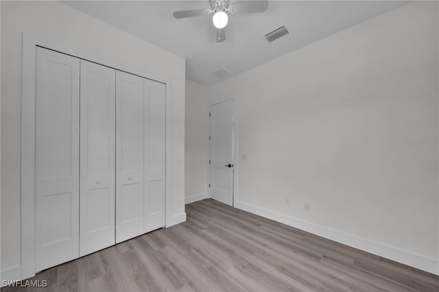 3109 11th St W, Lehigh Acres, FL 33971 - unfurnished bedroom featuring ceiling fan, baseboards, wood finished floors, visible vents, and a closet