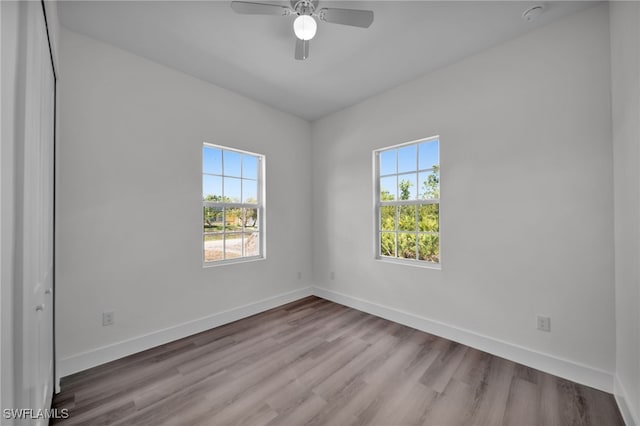 3109 11th St W, Lehigh Acres, FL 33971 - spare room with a ceiling fan, baseboards, and wood finished floors