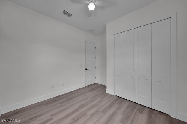 3109 11th St W, Lehigh Acres, FL 33971 - unfurnished bedroom with visible vents, light wood-style floors, baseboards, and a closet