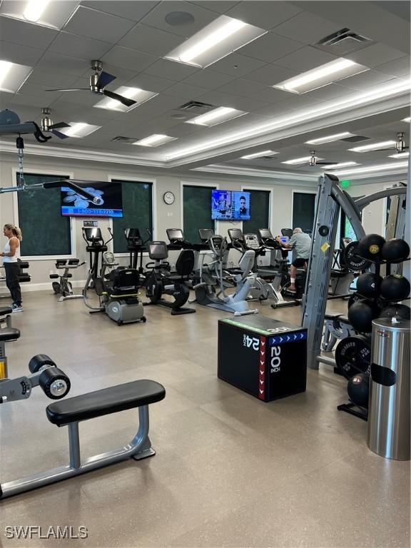 workout area with a drop ceiling and visible vents