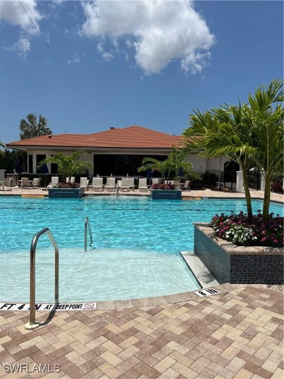 pool with a patio area